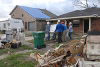 Tens of thousands of homeowners face the start of the hurricane season with blue plastic tarps still covering their roofs.