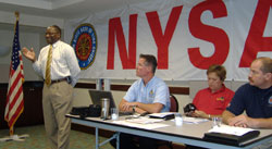New York State Fire Administrator Chief Floyd Madison (standing) speaks during the NYS Fire Marshals and Inspectors Association (NYS FMIA) Meeting.